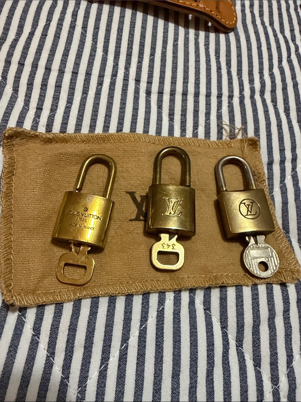 Louis Vuitton Brass Padlock Trio in Gold and Silver Tones